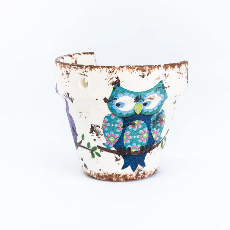 Candle holder painted with owls